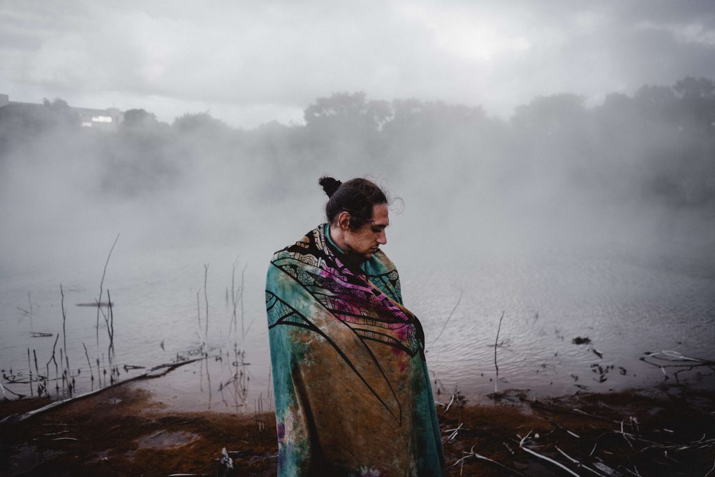Therapist and Indigenous client walking outdoors